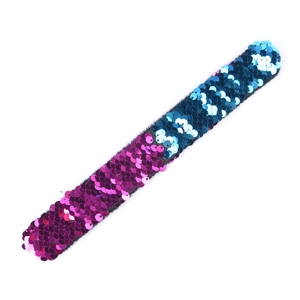 Detail of two-tone purple and blue sequin slap bracelet with shimmering texture