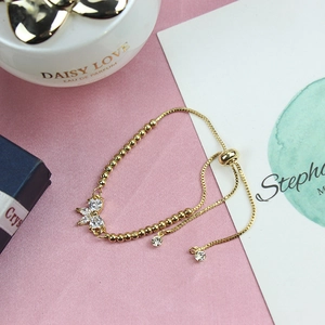 Detail of adjustable gold bead chain bracelet with marquise-cut cubic zirconia petals