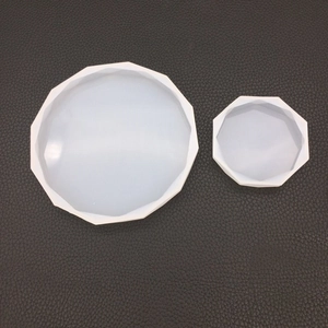 Macro view of two hexagonal silicone resin molds in different sizes on black background