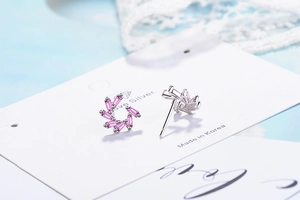 Macro shot of pink zircon geometric flower stud earrings in s925 sterling silver