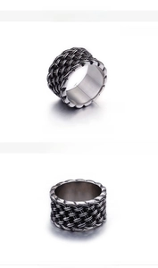 Detailed view of 12mm wide titanium steel ring with retro woven texture and 10g weight