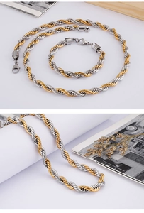 Detailed macro view of two-tone gold and silver twisted rope chain necklace and bracelet