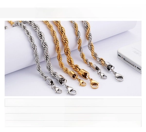 Detailed view of twisted rope chain necklaces in steel and gold finish with lobster clasp