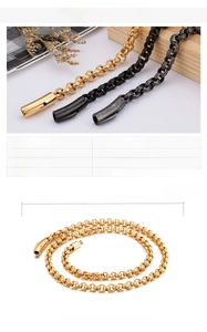Detailed close-up of stainless steel O-chain necklaces in gold, black and silver finishes