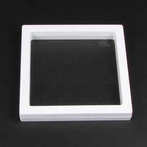 Detail of clear PE film inside a white floating jewelry display box for rings