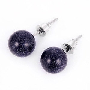 Detail of 10mm round blue sandstone stud earrings with silver-plated butterfly backs