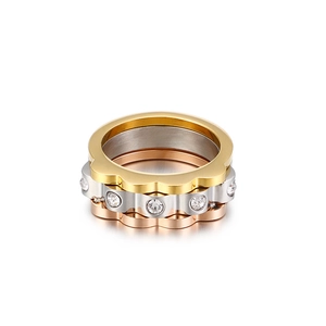 Three-piece stackable gear rings in gold, silver and rose gold with white zircon crystals