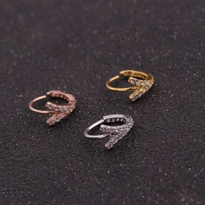 Three V-shaped piercing hoops in gold, rose gold and silver with micro-pave zircons