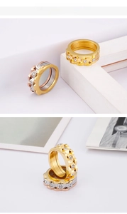 Detailed view of wave-shaped stainless steel rings with sparkling cubic zirconia pavé