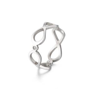 Elegant infinity silver steel ring with a sparkling crystal center from a side view