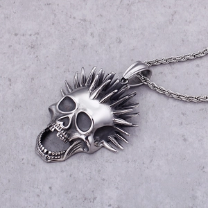 Vintage punk skull pendant in silver stainless steel with spiked details and twisted chain