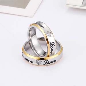 Two-tone silver and gold couple rings engraved with Forever Love and cubic zirconia
