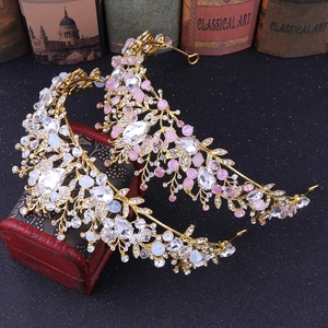 Baroque bridal crowns with clear and pink crystals on a vintage red box background