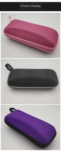 Close-up of hard shell EVA cases with diamond pattern and zipper in pink, black, purple