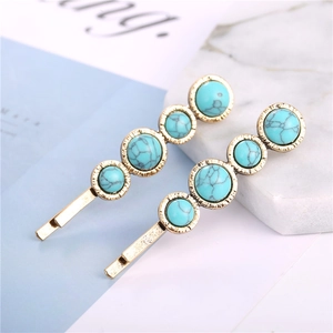 Retro bohemian hair clips featuring turquoise-style oval beads on gold-finish metal bases