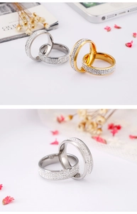 Close-up of double-layered paved crystal rings in gold and silver finish with floral decor