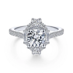 Luxury halo style ring with round center diamond and baguette cut side stones