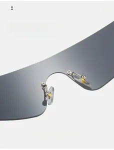 Detail of soft silicone nose pads and metal bridge on rimless sporty sunglasses