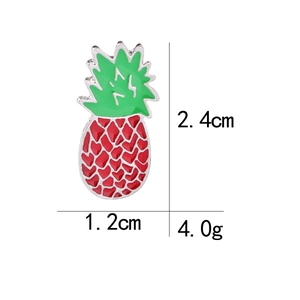 Detail showing red enamel pineapple brooch dimensions 2.4cm by 1.2cm and 4.0g weight