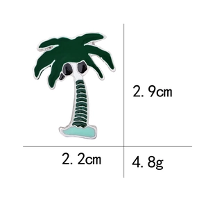 Detail showing palm tree enamel brooch dimensions 2.9cm x 2.2cm and 4.8g weight