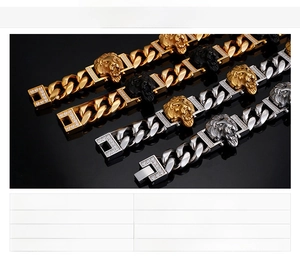 Macro shot of 18K gold plated stainless steel lion head pendant on heavy cuban chain bracelet