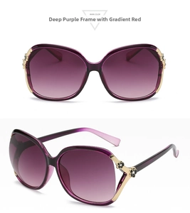 Detailed side view of deep purple sunglasses with golden camellia floral pattern