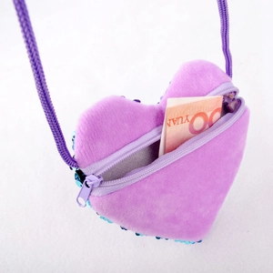 Mini heart shaped plush purse for kids featuring purple faux fur and blue sequins accents