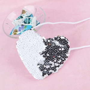 Detail view of heart-shaped mini sequin bag with silver and black flip sequins for kids