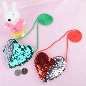 Detailed view of sequin heart-shaped mini bags with shiny crossbody lanyards for kids