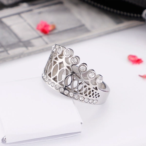 Elegant silver crown ring in titanium steel with sparkling zircons on a white background