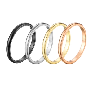 Polished stainless steel rings in black, silver, gold, and rose gold finishes