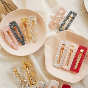 Sparkly geometric resin hair clips with foil flakes in drop and rectangle shapes