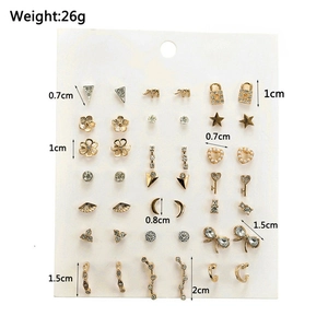 Detailed collection of 18 pairs of gold-tone earrings with pearls and crystal accents