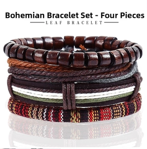 Close-up of a 4-piece bohemian set with leather braids, wooden beads and leaf bracelet