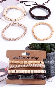 Detail of 4-piece woven leather bracelet set with wood beads and Best Friend metal charm