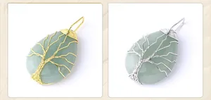 Macro detail of wire-wrapped tree of life pendant with natural green aventurine stone