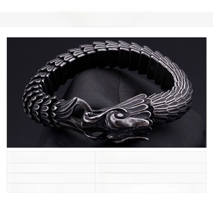Macro shot of stainless steel dragon scale bracelet with vintage black texture and details