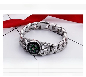 Close-up of vintage compass bracelet showing 316L stainless steel clasp and cuban chain