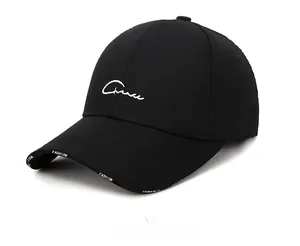 Detail of black cotton baseball cap showing white Chance embroidery and Fashion print brim