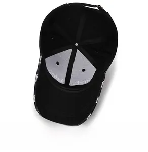Internal structure of black cotton baseball cap showing seams and metal buckle