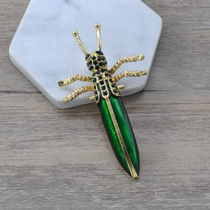 Baroque style green enamel grasshopper brooch with sparkling rhinestones on gold base