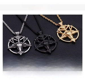 Close-up of stainless steel Baphomet pendants in gold, silver, and black colors