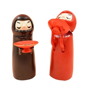 Electric No Face Man piggy bank with music feature in red and black colors