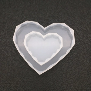 Macro shot of geometric faceted heart silicone mold for DIY resin and soap crafts
