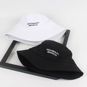 Classic cotton bucket hats in black and white with Brooklyn embroidery for sun protection