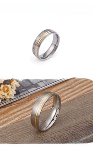 Close-up of matte stainless steel gold-toned rings with small sparkling cubic zirconia