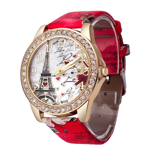 Detail of Eiffel Tower watch with rhinestone bezel and red floral pattern leather strap