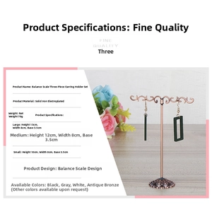 Three sizes of bronze balance-style earring display stands with height specifications