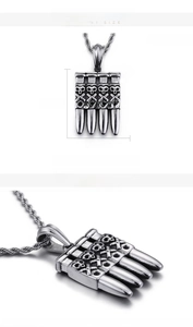 Macro detail of silver skull bullet pendant with dimensions 38mm by 28mm for men