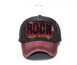 Detailed macro view of retro washed cotton baseball cap with ROCK embroidery and brim distressing